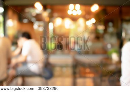Abstract Blur Of Interior Inside Coffee Cafe Shop Background With Light Effect For Design Element. B