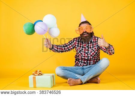 Holiday Celebration. Bearded Mature Man Celebrate Birthday Party. Cheerful Man In Bday Hat Hold Holi