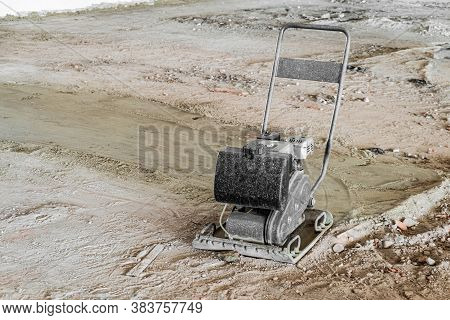 Tamping Machine With Vibratory Plate. Vibratory Rammer Machine Compresses The Base Soil For Subseque