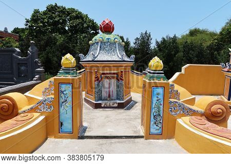 Hoi An, Vietnam, May 3, 2020: Orange Colored Mausoleum In The Cemetery Of The Chùa Phước Lâm Temple.