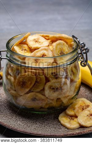 Healthy Snack, Crispy Dehydrated Unsugared Banana Chips In Glass Jar
