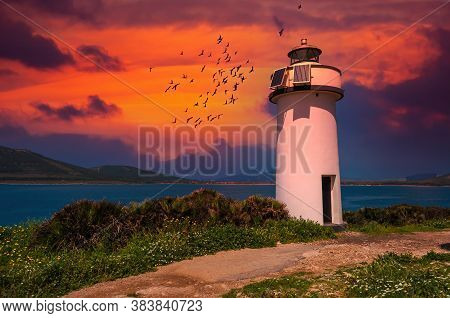 Lighthouse On The Coast At Sunset