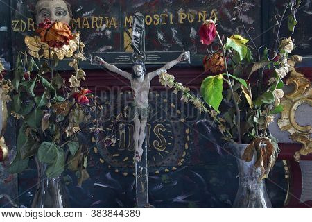 ZABOK, CROATIA - JULY 06, 2013: Crucifix on Our Lady's altar in the chapel of St. Anthony of Padua in Grabrovec, Zabok, Croatia