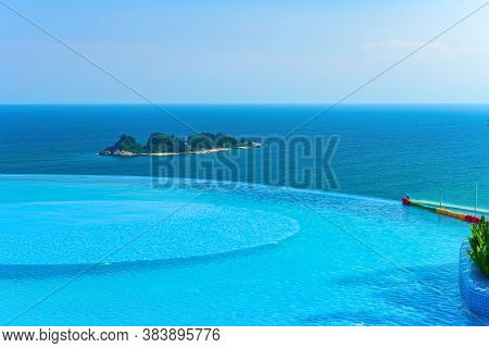 Edgeless Swimming Pool In Front Of An Ocean