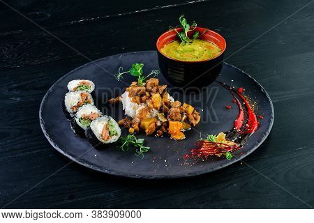 Japanese Lunch Set. Asian Food Set Soup, Sushi Rolls And Side Dish, Rice In A Bowl With Miso Soup
