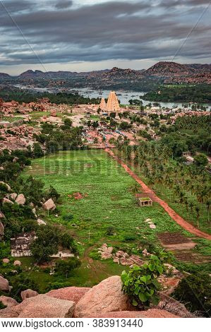 Virupaksha Temple With Bright Dramatic Sky And Rocky Mountain Background At Morning Image Is Taken A