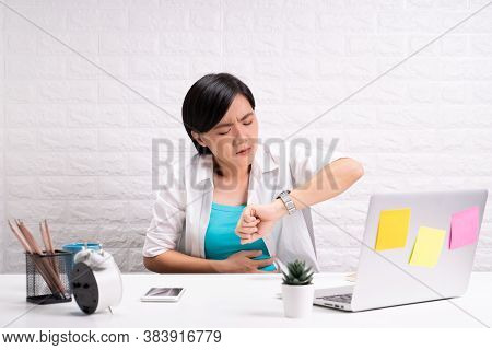 Woman Has Stomachache At Office