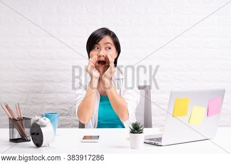 Woman Sitting At Home Office Using Computer Laptop And Saying Secret News