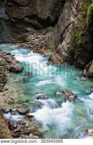 Clean, Beautiful, Mountain River Flows Through A Rocky Gorge Partnachklamm In Germany Incised By A M