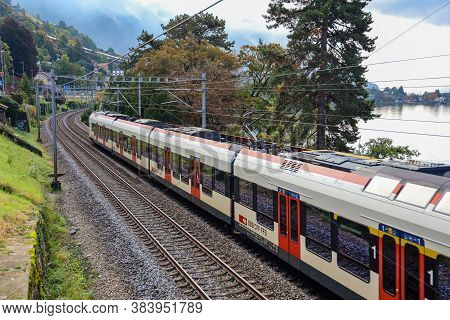 Montreux ,switzerland-october 23,2019:the Train On Railway In Front Of  Lake Geneva In Montreux At S