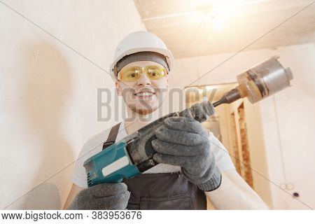 Builder Worker Man Makes Selfie Photo With Safety Glasses And White Helmet With Pneumatic Hammer Dri