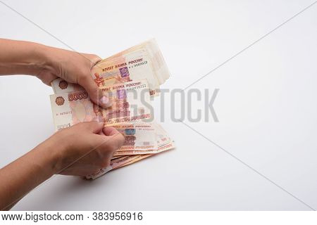 Hands Count Money In A Bundle Of Five-thousandth Russian Bills