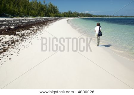 Walking Along The Winding Bay Beach