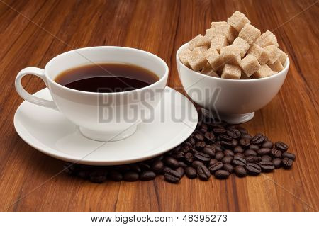 Coffee Cup And Saucer On A Wooden Table