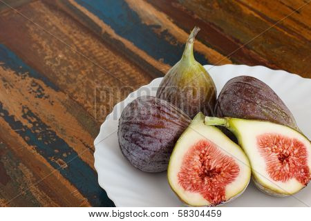 Figs On Plate On Wooden Table