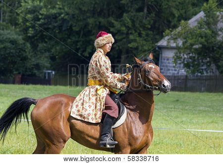 History Fan Dressed As 17Th Century Polish Cavalryman With A Sabre In His Hand
