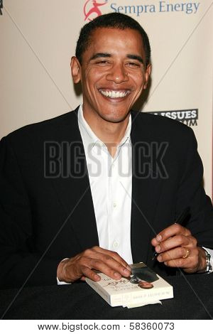 Barack Obama signing copies of his book 