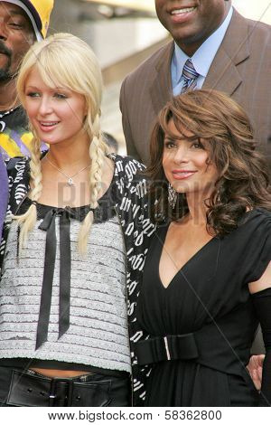 Paris Hilton and Paula Abdul at the Ceremony Honoring Los Angeles Lakers Owner Jerry Buss with the 2,323rd star on the Hollywood Walk of Fame. Hollywood Boulevard, Hollywood, CA. 10-30-06