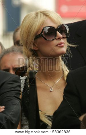 Paris Hilton at the Ceremony Honoring Los Angeles Lakers Owner Jerry Buss with the 2,323rd star on the Hollywood Walk of Fame. Hollywood Boulevard, Hollywood, CA. 10-30-06