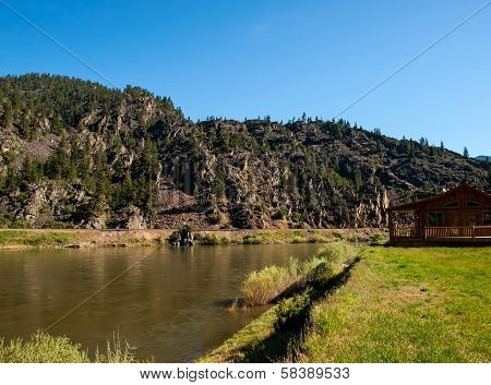 Wide Mountain River And A Log Cabin - Clark Fork River Montana Usa