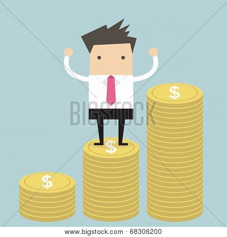 Businessman standing on gold coin