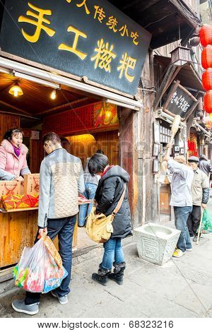 CHONGQING, CHINA - JAN 17: Unidentified tourists are shopping at Ciqikou Ancient Town on January  17, 2014 , Chongqing, China.