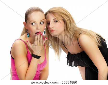 Two Young Woman Wispering Secrets