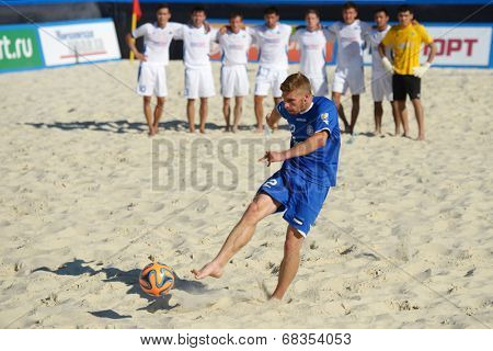 MOSCOW, RUSSIA - JULY 13, 2014: Ragnar Rump, Estonia performs penalty shoot-out in the match with Kazakhstan during Moscow stage of Euro Beach Soccer League. Kazakhstan won 3:2 after penalty shoot-out
