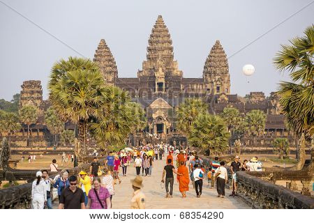 ANGKOR, CAMBODIA - MARCH 11: Tourists visit the historic Angkor Wat temple complex on March 11, 2014 in Angkor, Cambodia. The UNESCO world heritage site attracted 1.12 mln visitors in Q2 of 2013.