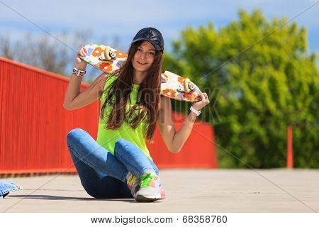 Summer Sport. Cool Girl Skater With Skateboard