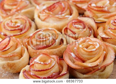Tasty  puff pastry with apple shaped roses on table close-up