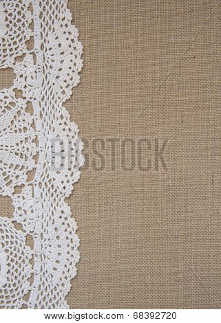 Ecu Burlap background with cream crochet lace