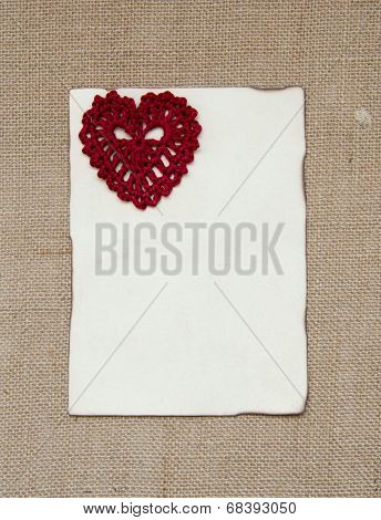 Valentine card with crochet heart over burlap