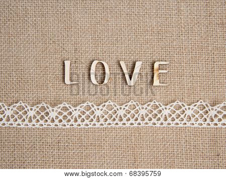Word love over burlap