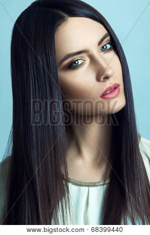 Beautiful young woman with long straight hair