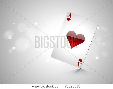 Glossy playing card ace on shiny grey background.
