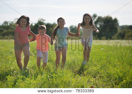 Group Of Happy Children Playing