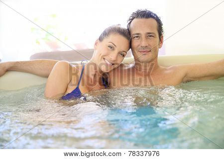 Romantic couple relaxing in hot tub