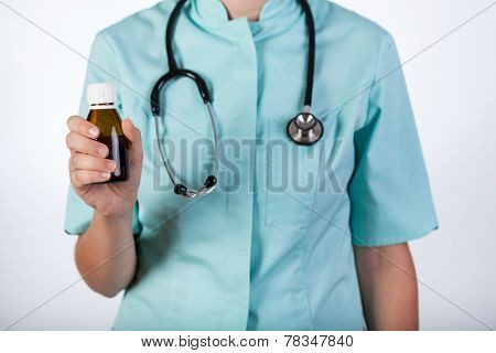 Doctor Holding Medicated Syrup