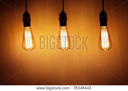 three vintage bulb lamps with warm light