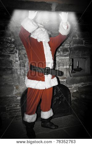 father christmas clumbing up a chimney