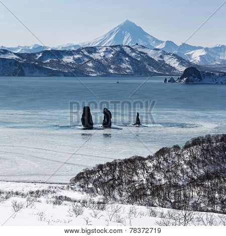 Three Brothers Rocks In Avachinskaya Bay And Viluchinsky Volcano (Kamchatka Peninsula)