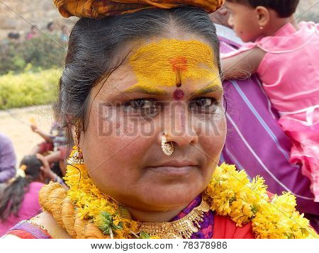 Hindu devotees carry bonam during Bonalu festival in temple