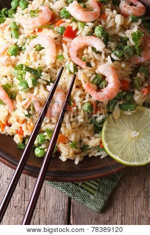 Fried Rice With Shrimp And Vegetables And Chopsticks. Vertical