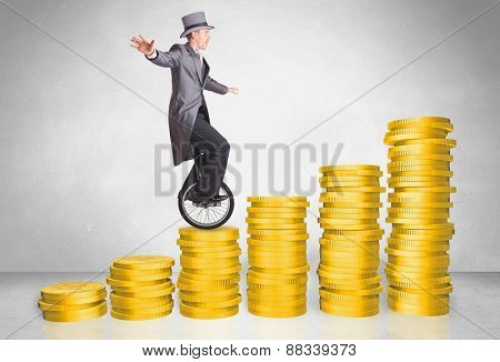 Business man riding monocycle up on coin graph concept on background