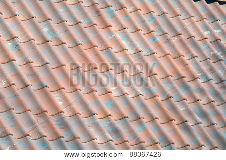 Red Tile Roof With Green Pieces