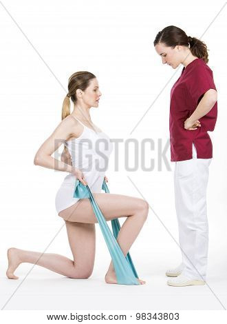 physiotherapist doing tone with flexible for spine