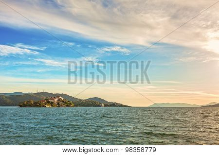 Beautiful Sunset on the sea, in the background mountains