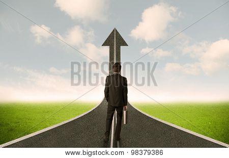 Businessman lokking at 3d road upgoing arrow concept