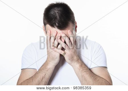 A man having a disturbing problem over white